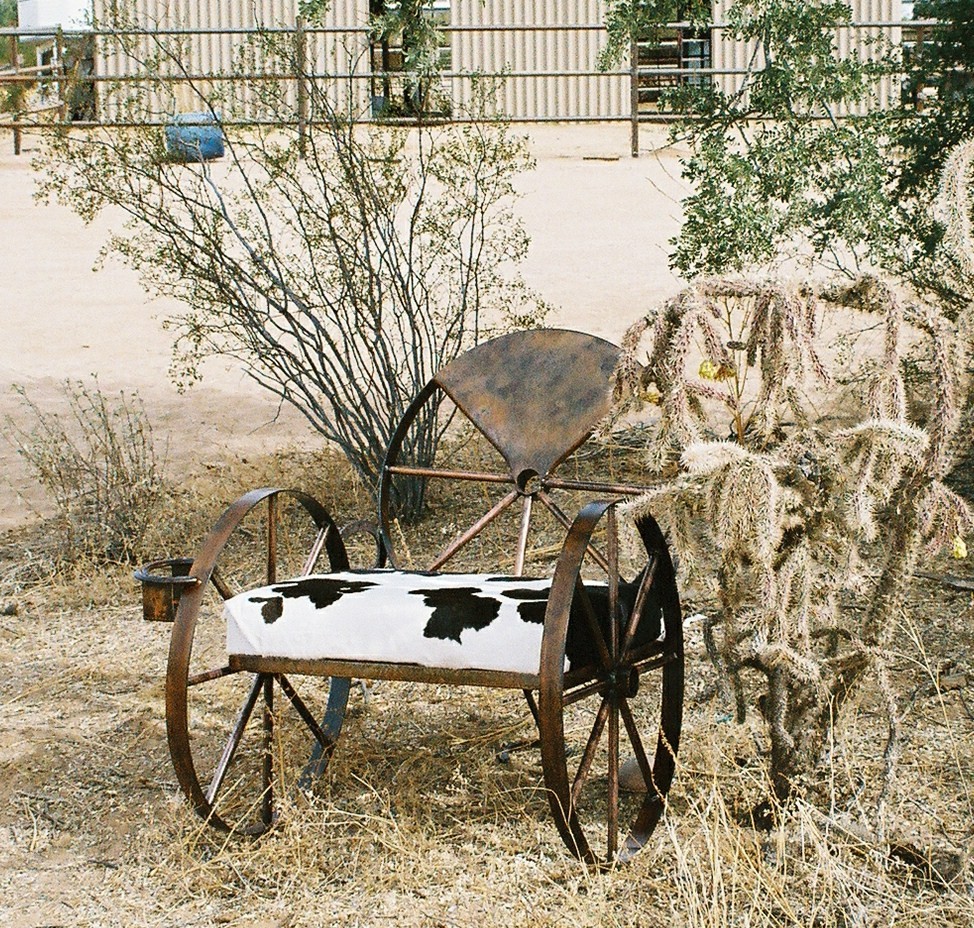 Wagon wheel chair with cow hide seat